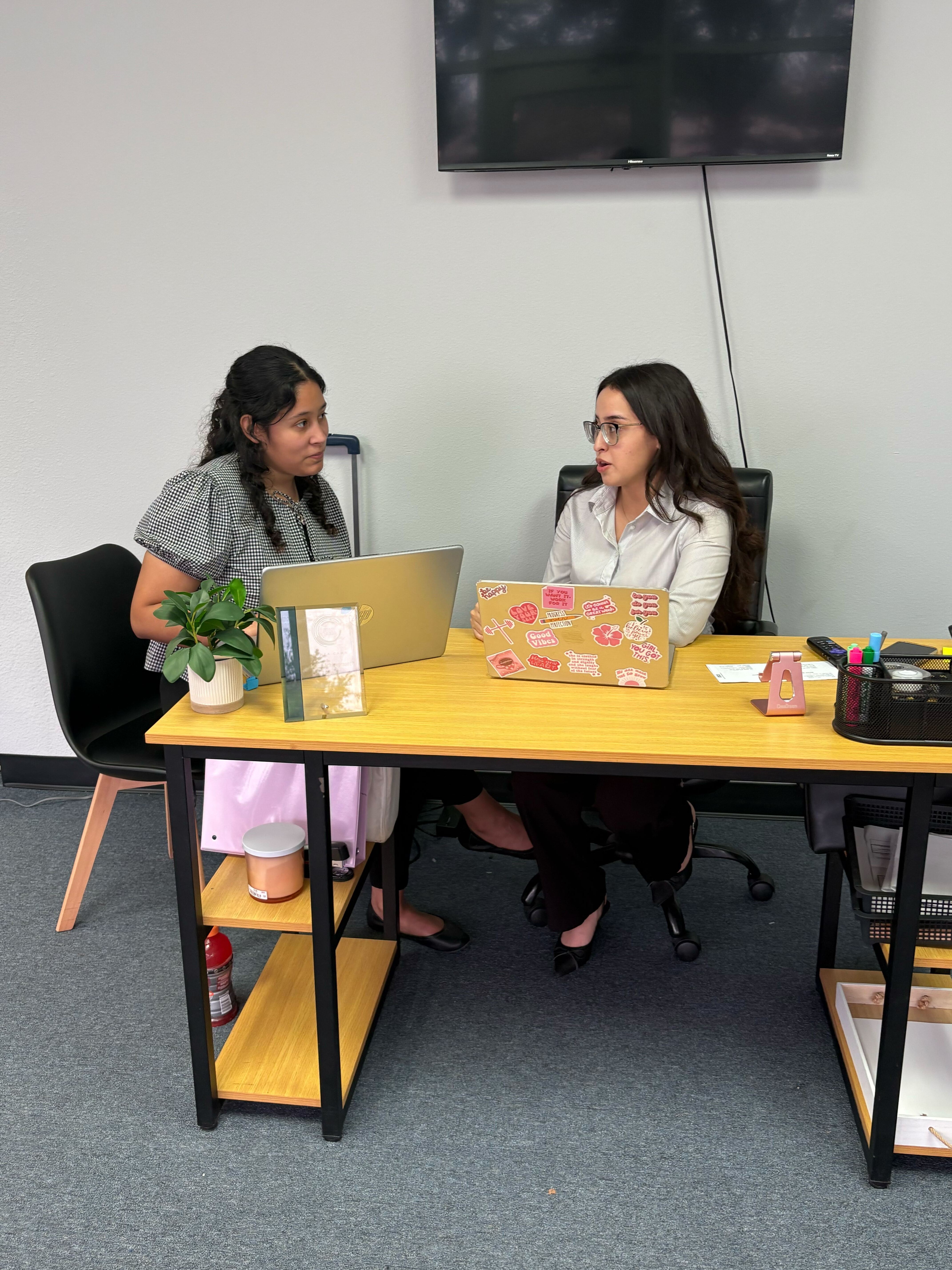 Palm City Management team members collaborating at a desk in the office